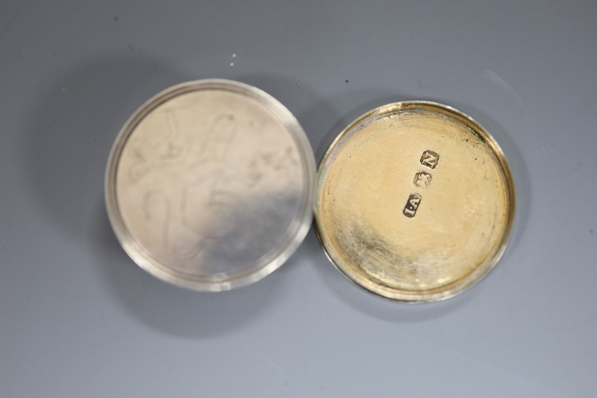 A George III silver circular vinaigrette with erotic engravings (faint), Joseph Ash I, London, 1808, 28mm.